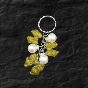 Handmade Golden Petal Resin Keychain with golden petals and pearls, created by Maryam.