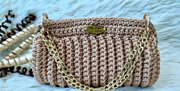 Handmade Beatriz Handbag with intricate macrame yarn art, featuring a gold-tone chain and versatile design, created by Arty-Crafty.