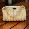 Handmade Beatriz Handbag with intricate macrame yarn art, featuring a gold-tone chain and versatile design, created by Arty-Crafty.