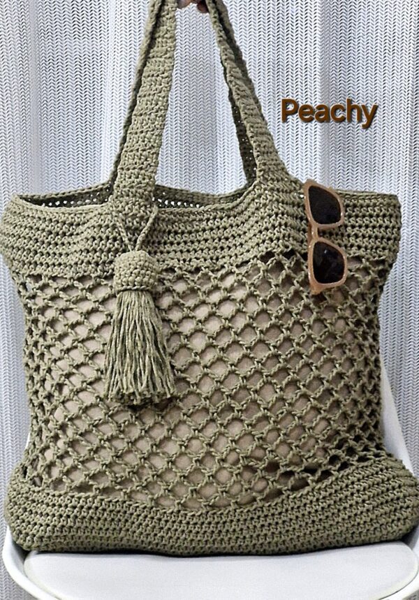 Handmade Peachy Beach Bag with macrame cotton yarn, featuring a spacious design and customizable colors, created by Arty-Crafty.