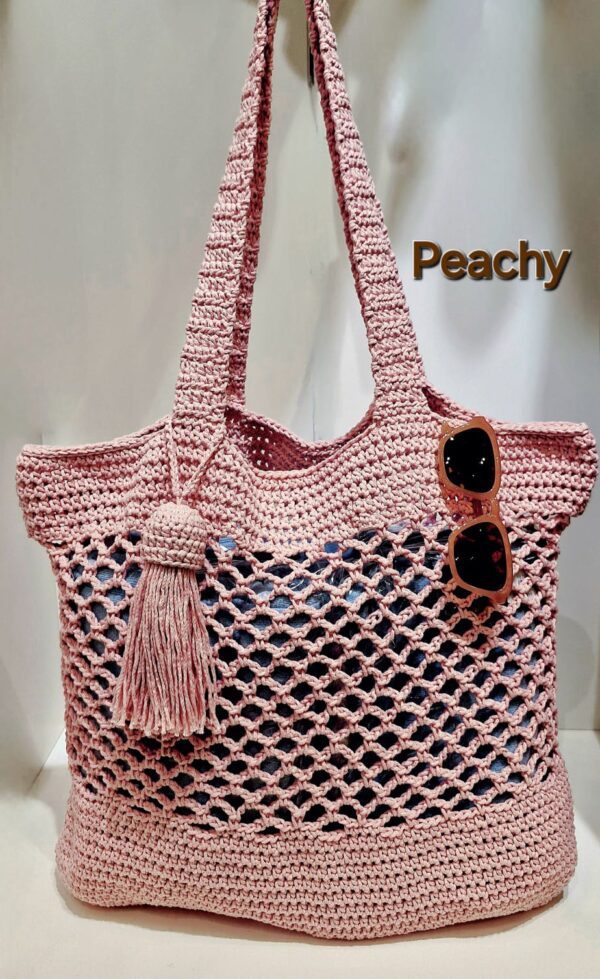 Handmade Peachy Beach Bag with macrame cotton yarn, featuring a spacious design and customizable colors, created by Arty-Crafty.