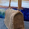 Handmade Charming Dorothy Bag with premium macrame yarn, featuring a spacious design and adjustable strap, created by Arty-Crafty.