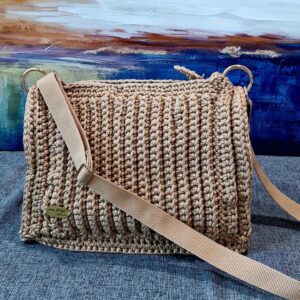 Handmade Charming Dorothy Bag with premium macrame yarn, featuring a spacious design and adjustable strap, created by Arty-Crafty.