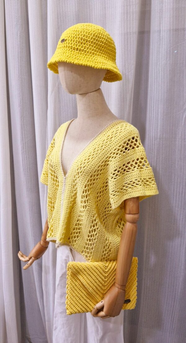 Yellow handmade cotton top named 'Marcella' by Arty-Crafty by Vanessa, featuring a delicate, flowy design with a V-neckline and intricate stitching, displayed on a mannequin