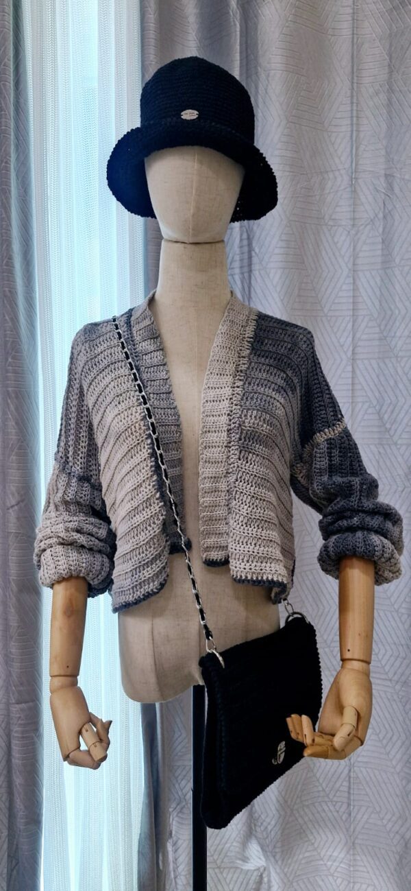 Handmade striped cardigan named 'Isabela Cardigan' by Arty-Crafty by Vanessa, crafted from a blend of cotton and acrylic yarn in shades of gray, featuring a lightweight, free-size design with an open front