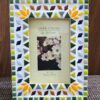 Handcrafted vibrant mosaic photo frame by Mosaicbyaroma, featuring colorful ceramic tiles in a 22x17 cm frame, perfect for displaying a 15x10 cm photo. Ideal for home décor or as a unique gift.