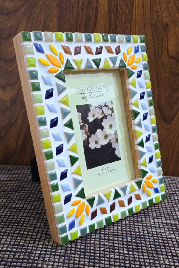 Handcrafted vibrant mosaic photo frame by Mosaicbyaroma, featuring colorful ceramic tiles in a 22x17 cm frame, perfect for displaying a 15x10 cm photo. Ideal for home décor or as a unique gift.