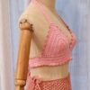 Handcrafted Chanti Bikini Set made from pink cotton and acrylic yarn, featuring a crochet halter top and matching bottoms,