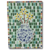 A colorful mosaic artwork featuring a vase filled with yellow flowers. The vase is composed of blue and white ceramic pieces, arranged on a background of green, pink, and white tiles. The border of the mosaic is framed with small, multicolored tiles, adding vibrant contrast to the piece.