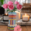 A handcrafted mosaic glass vase featuring colorful glass tiles arranged in vibrant patterns, sealed with white color, and measuring 10x20 cm, perfect for home or office décor.