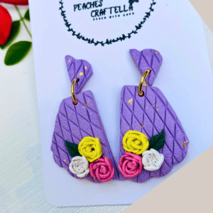 Lilac lattice floral earrings with pink, yellow, and white flowers by Ishara Malshani Settinayake of Peaches Craftella.