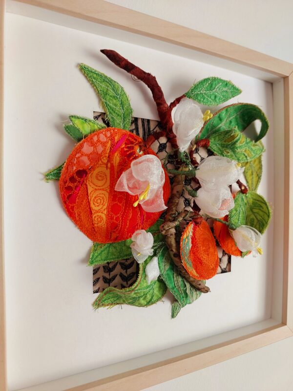 Handmade 3D Jaffa Oranges textile art in a wooden frame featuring organza roses and copper wire branches.