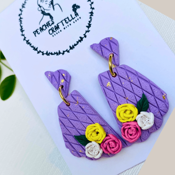 Lilac lattice floral earrings with pink, yellow, and white flowers by Ishara Malshani Settinayake of Peaches Craftella.