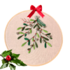 Hand-embroidered Christmas mistletoe wall art featuring green mistletoe leaves, red berries, and silver bells, framed in an 8-inch wooden hoop with a red ribbon, created by Anu Paulson.