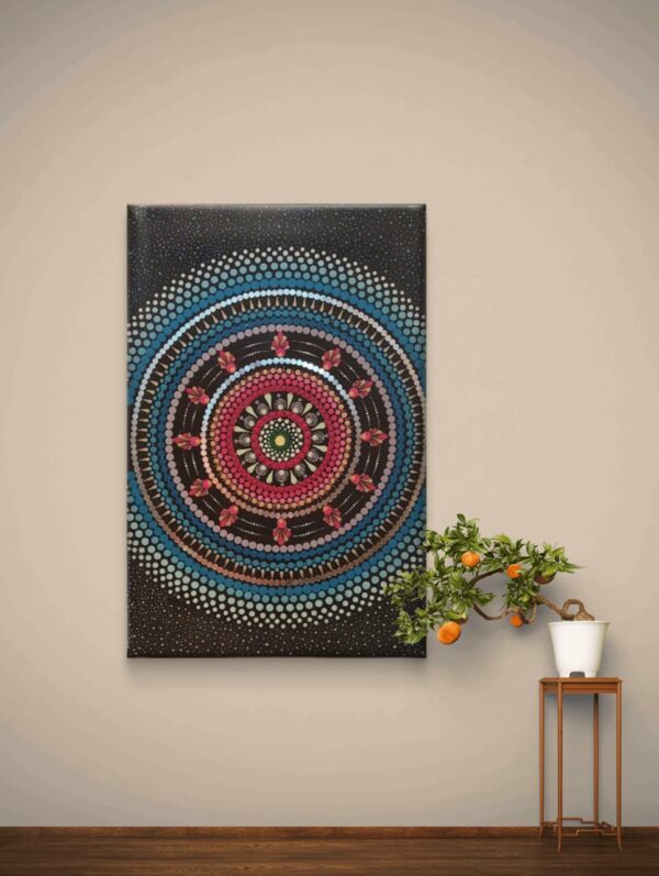 Cosmic Blossom Mandala, a 40x60 cm handcrafted mandala art on canvas by Krutika Jariwala, featuring cosmic-inspired patterns with vibrant pink, blue, and green details.