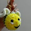 Handmade honey bee keychain made with soft yellow velvet yarn, featuring black stripes, cute wings, and a sturdy keyring for easy attachment to keys or bags. Perfect for bee lovers and as a fun accessory.