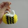 Handmade honey bee keychain made with soft yellow velvet yarn, featuring black stripes, cute wings, and a sturdy keyring for easy attachment to keys or bags. Perfect for bee lovers and as a fun accessory.