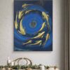 Acrylic painting titled Dance of Gold Fish by Sanaz Noorparvar, featuring gold fish covered with gold sheets swimming in circular motion against a deep blue background, symbolizing life's flow and tranquility.