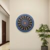 Blue Serenity Mandala, a 30 cm handcrafted mandala art on canvas board by Krutika Jariwala, featuring intricate patterns with calming blue, green, and gold tones.