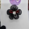 Handmade floral hairband in UAE National colors with black flower and white rose, perfect for kids and special events.