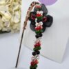 Handmade floral hairband in UAE National colors with black flower and white rose, perfect for kids and special events.