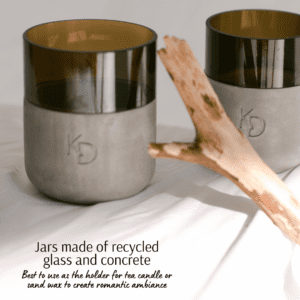 Recycled glass and concrete jars by Katty’s Design, suitable as holders for makeup brushes, pens, or candles.