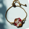 Blossom Hexagon Resin Bracelet with preserved flowers encased in resin, featuring an adjustable gold-plated chain.