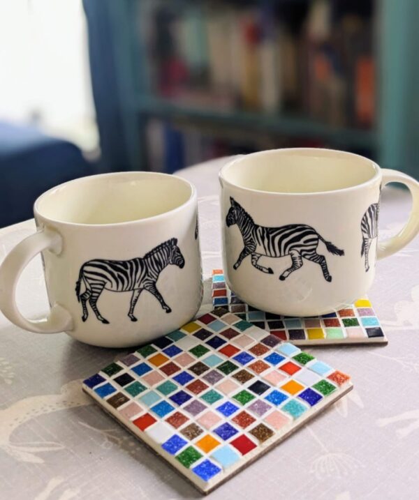 Handmade mosaic coaster kit with glass tiles and instructions, perfect for creating unique, colorful coasters.