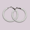 Handmade macrame earrings in classic white, circular hoop design by Rita Lewis.