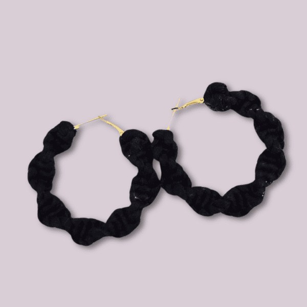 Handmade twisted black macrame earrings, circular hoop design by Rita Lewis