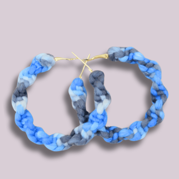 Handmade twisted macrame earrings in midnight tones of blue, gray, and white, circular hoop design by Rita Lewis.