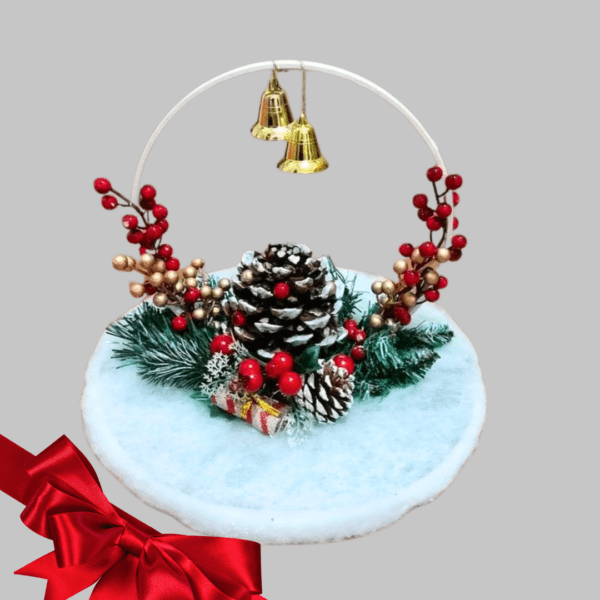 Festive pine cone decoration with berries, bells, and greenery on a wooden base.