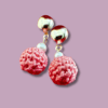 Handmade earrings with round metal stud and pink macrame dangle, designed by Rita Lewis.