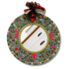 A handcrafted round Christmas Mosaic Mirror adorned with red and green ceramic and glass tiles, featuring a festive bow, pinecone, and bell decoration. Sealed in grey, 30 cm in diameter. Perfect for holiday décor.