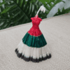 Dress-shaped soy-wax candle in UAE National Day colors, customizable for any festive theme.