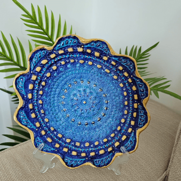 Handcrafted air-dry clay decorative plate with vibrant blue and gold mandala design, includes acrylic holder.