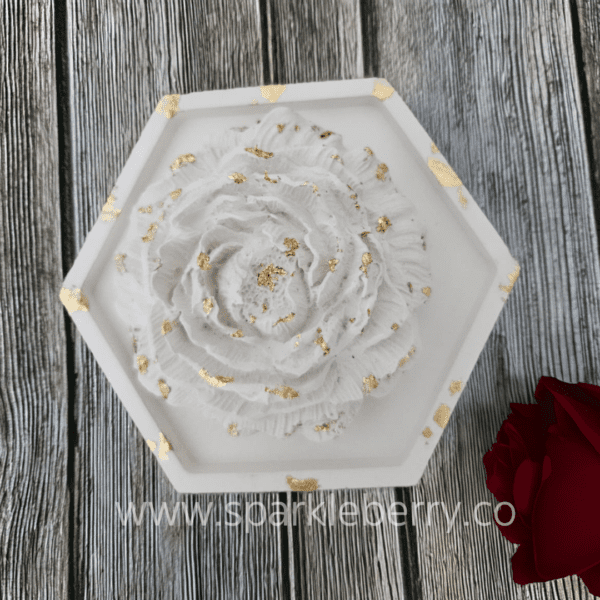 Gypsum rose on a hexagon tray with gold accents, perfect for home décor and fragrance infusion.