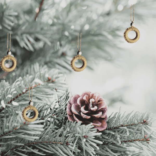 Handmade golden macrame Christmas ornament with a 2.25-inch ring diameter, featuring a sparkling design.