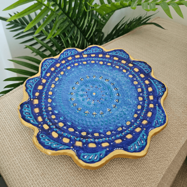 Handcrafted air-dry clay decorative plate with vibrant blue and gold mandala design, includes acrylic holder.