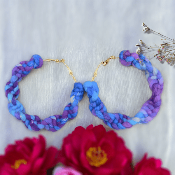 Handmade twisted macrame earrings in cornflower blue and purple tones by Rita Lewis.