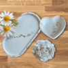 Gypsum heart-shaped dish and rose on an elegant tray, accented with gold, perfect for home décor and fragrance infusion.