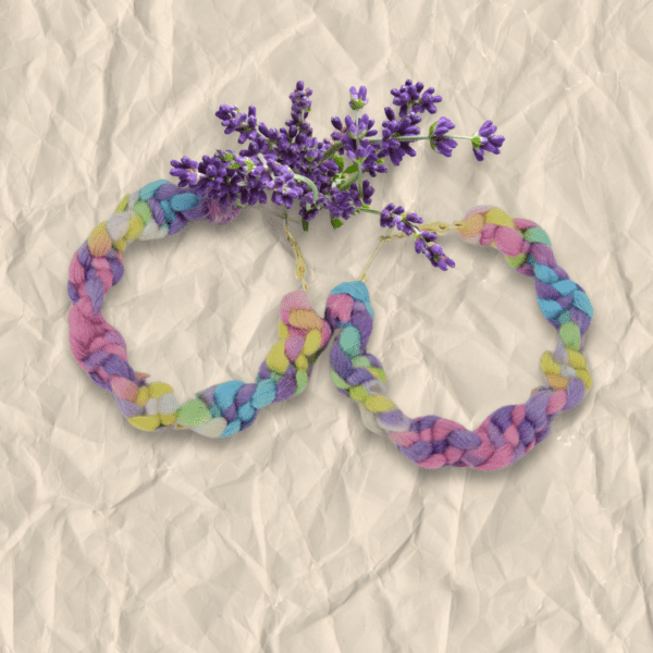 Handmade twisted macrame earrings in unicorn colors (pastel pink, purple, blue, yellow), circular hoop design by Rita Lewis