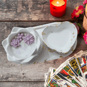 3-piece set with customizable essential oil candle, heart-shaped trinket tray, and oval base tray, perfect for small space décor and fragrance.