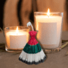 Dress-shaped soy-wax candle in UAE National Day colors, customizable for any festive theme.