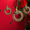 Handmade red and green macrame Christmas ornament with a 2.25-inch diameter, featuring classic holiday colors.