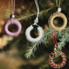 Set of 4 handmade macrame Christmas ornaments in white, golden, pink, and red & green designs, with a ring diameter of 2.25 inches.