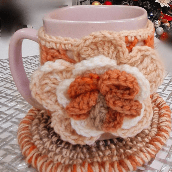 Handmade Blissful Brew Set featuring a crochet mug cover and matching coaster. Customizable colors include blue, red, green, and festive patterns. A perfect gift for tea and coffee lovers.