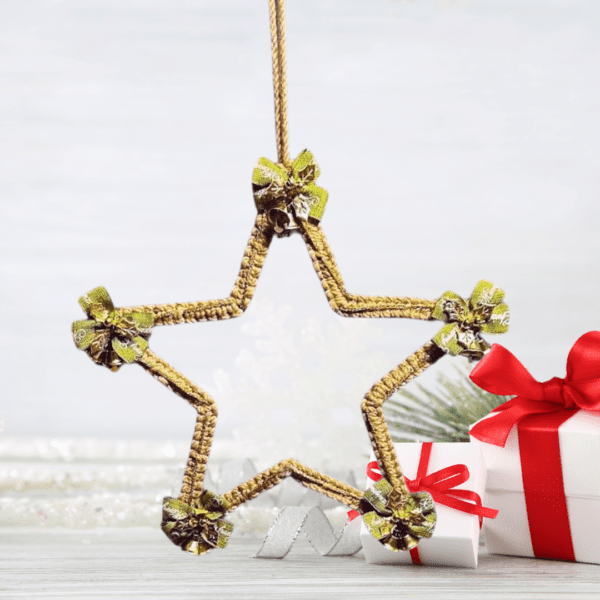 Handmade macrame Christmas decor star with golden bows, 9.5 inches in diameter, perfect for festive decorations.