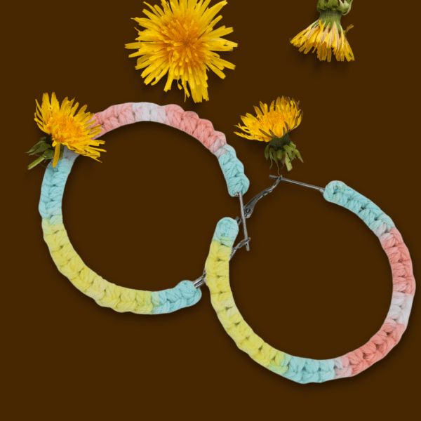 Handmade Lutino macrame earrings featuring pastel colors in a circular hoop design by Rita Lewis.