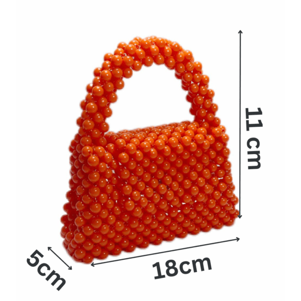 Handcrafted orange beaded bag with a unique, eye-catching design.